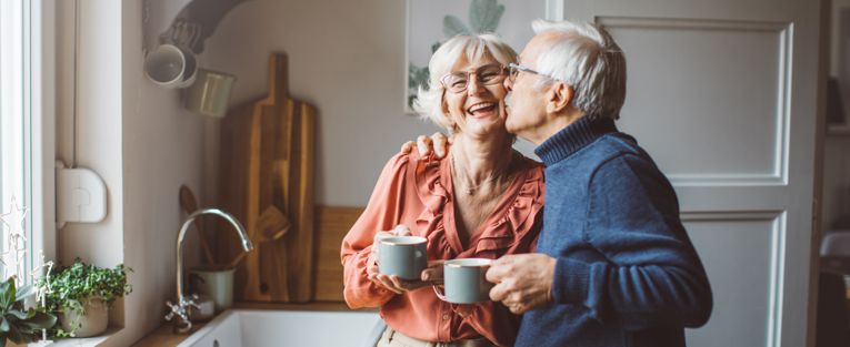 senior-couple-enjoying-coffee-in-the-kitchen