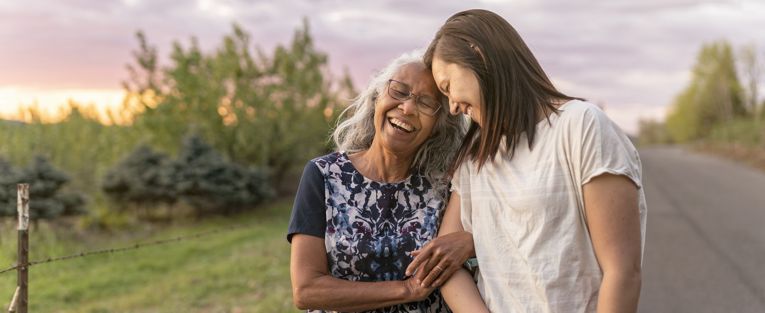 senior-woman-walking-with-young-lady