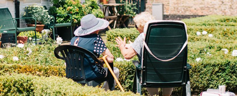 senior-women-chatting-in-the-garden