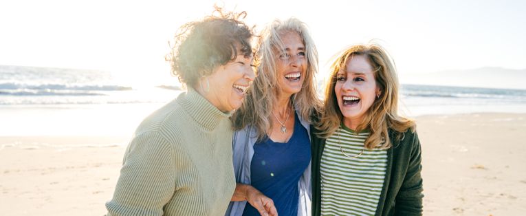 senior-women-having-fun-at-beach